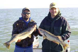 Mark Cassidy and man with fish, Fall Fishing Cast-A-Way Charters Photo Gallery